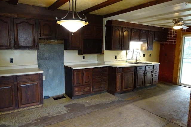 1305 La Crescent St, Campbell Twp, WI 54603 - kitchen featuring a sink, beamed ceiling, a ceiling fan, dark brown cabinets, and pendant lighting