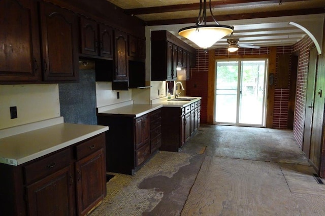 1305 La Crescent St, Campbell Twp, WI 54603 - kitchen featuring a ceiling fan, dark brown cabinets, and a sink