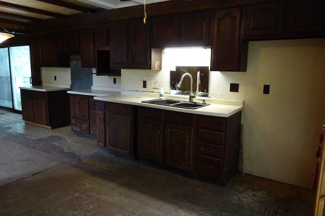 1305 La Crescent St, Campbell Twp, WI 54603 - kitchen featuring a sink, dark brown cabinetry, backsplash, beam ceiling, and light countertops