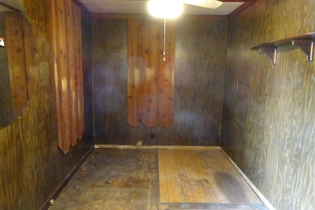 1305 La Crescent St, Campbell Twp, WI 54603 - empty room with a ceiling fan, hardwood / wood-style floors, and wooden walls