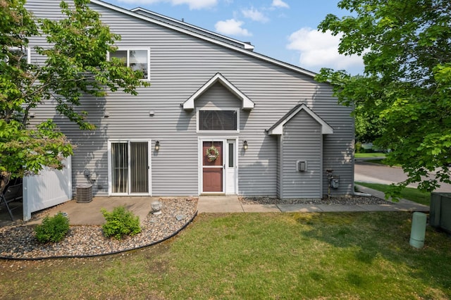 547 Woodduck Dr Unit G, Woodbury, MN 55125 - back of house with a yard and a patio