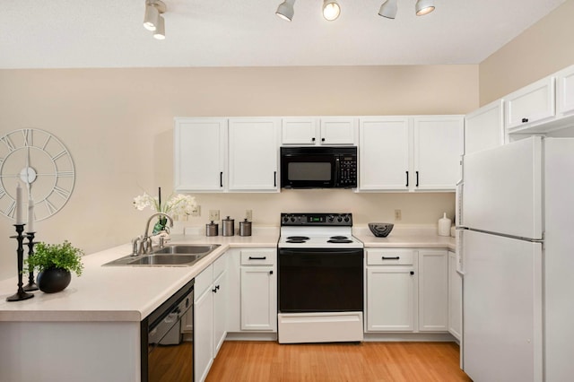 547 Woodduck Dr Unit G, Woodbury, MN 55125 - kitchen with black appliances, a sink, white cabinets, and light countertops