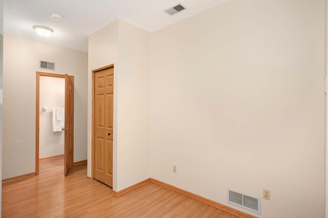 547 Woodduck Dr Unit G, Woodbury, MN 55125 - empty room with light wood finished floors and baseboards