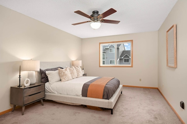 547 Woodduck Dr Unit G, Woodbury, MN 55125 - bedroom featuring light colored carpet, baseboards, a ceiling fan, and a textured ceiling