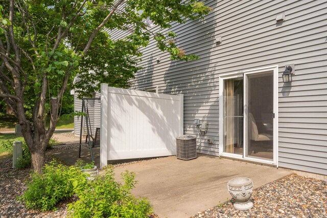 547 Woodduck Dr Unit G, Woodbury, MN 55125 - view of patio / terrace featuring central AC