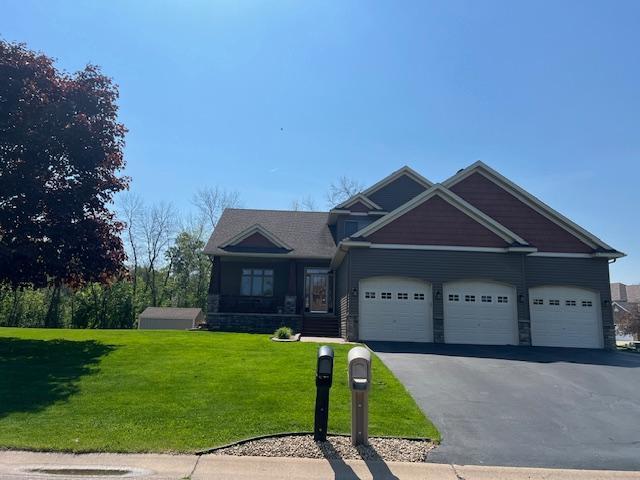 6730 210th Ct N, Forest Lake, MN 55025 - craftsman inspired home featuring asphalt driveway, a front lawn, and a garage