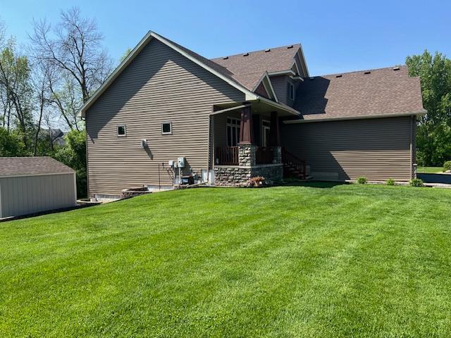 6730 210th Ct N, Forest Lake, MN 55025 - rear view of house featuring a yard