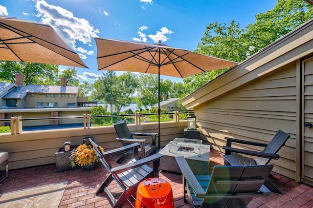 120 Eastbank Ct N, North Hudson, WI 54016 - view of patio with an outdoor fire pit