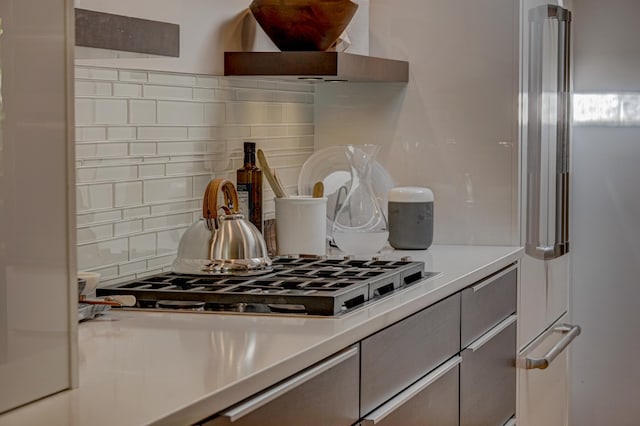 120 Eastbank Ct N, North Hudson, WI 54016 - detailed view of gas stovetop, tasteful backsplash, and light countertops