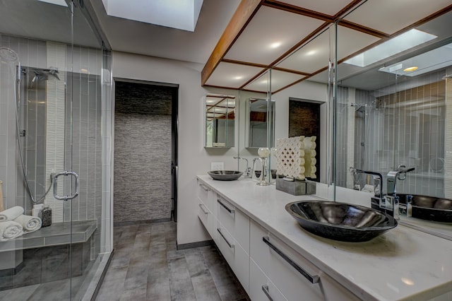 120 Eastbank Ct N, North Hudson, WI 54016 - full bathroom with double vanity, a stall shower, wood finished floors, and a skylight