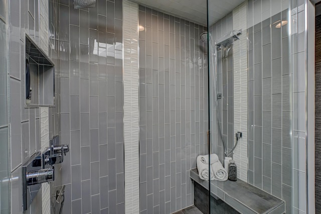 120 Eastbank Ct N, North Hudson, WI 54016 - bathroom featuring walk in shower and tile walls