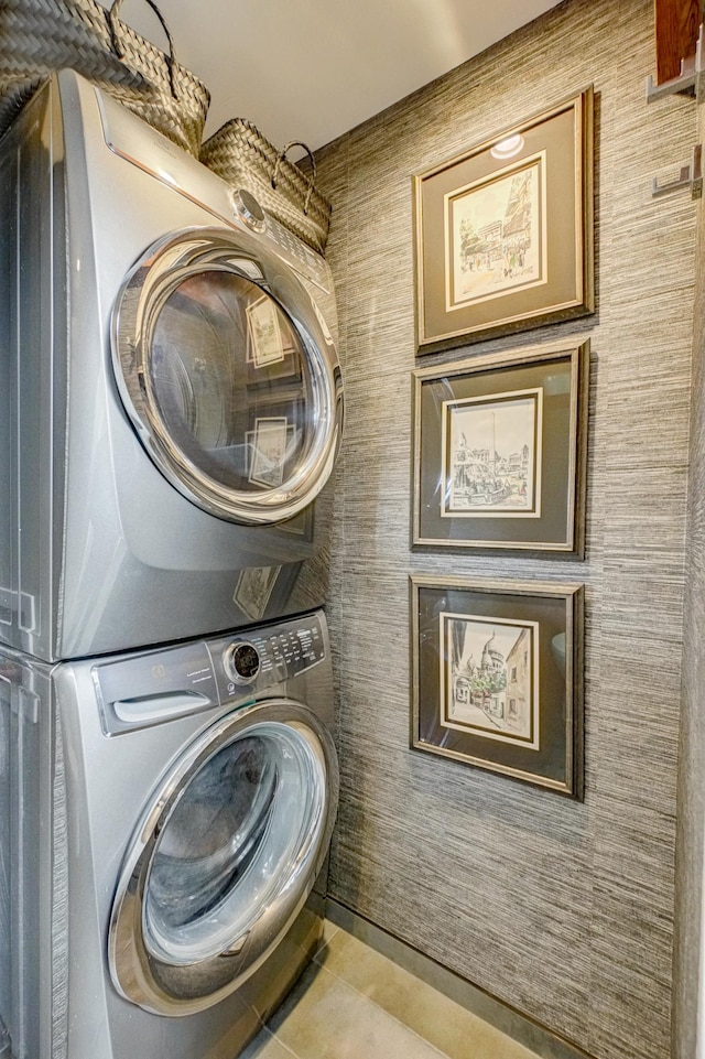 120 Eastbank Ct N, North Hudson, WI 54016 - laundry room featuring stacked washer / dryer and tile patterned floors
