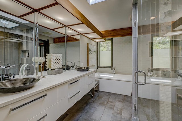 120 Eastbank Ct N, North Hudson, WI 54016 - bathroom featuring double vanity, a stall shower, a garden tub, and wood finished floors