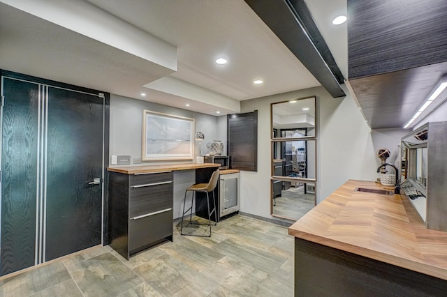 120 Eastbank Ct N, North Hudson, WI 54016 - kitchen with butcher block countertops, a sink, an office area, and recessed lighting