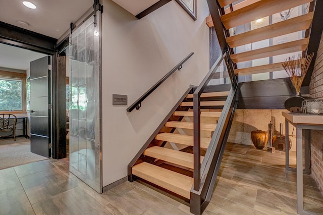 120 Eastbank Ct N, North Hudson, WI 54016 - stairs with a barn door