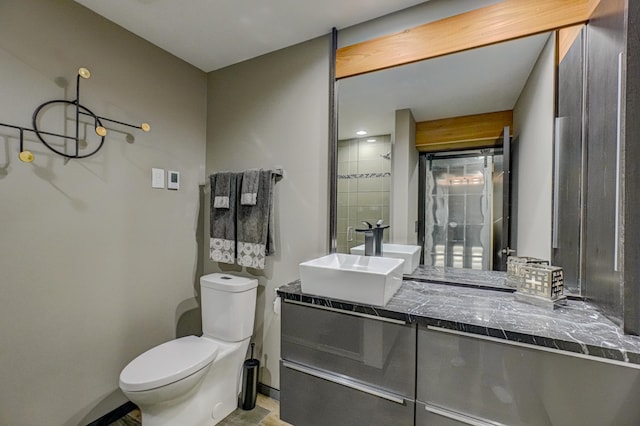 120 Eastbank Ct N, North Hudson, WI 54016 - bathroom with toilet, vanity, baseboards, and a shower