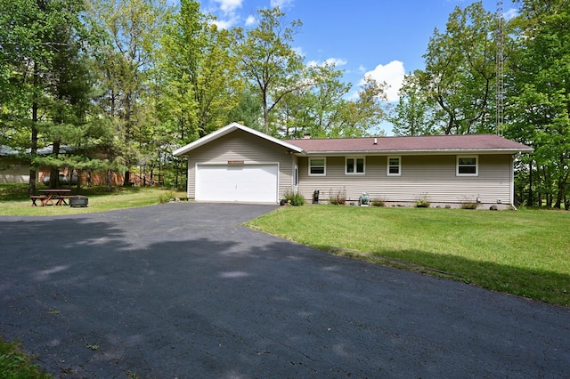 W2847 County Highway B, Madge Twp, WI 54870 - ranch-style house featuring a garage, driveway, and a front lawn