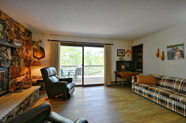 W2847 County Highway B, Madge Twp, WI 54870 - living area featuring wood finished floors and a textured ceiling