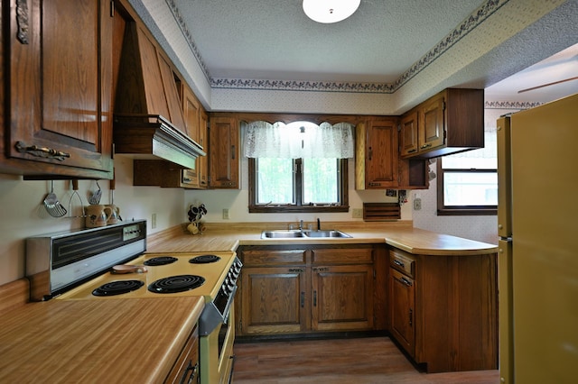 W2847 County Highway B, Madge Twp, WI 54870 - kitchen with freestanding refrigerator, a sink, electric range oven, light countertops, and a textured ceiling