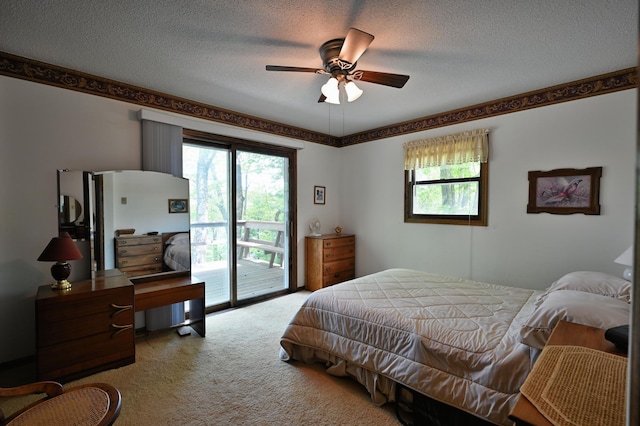 W2847 County Highway B, Madge Twp, WI 54870 - carpeted bedroom with access to exterior, multiple windows, a textured ceiling, and ceiling fan