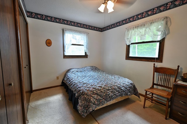 W2847 County Highway B, Madge Twp, WI 54870 - bedroom featuring carpet floors, baseboards, and ceiling fan