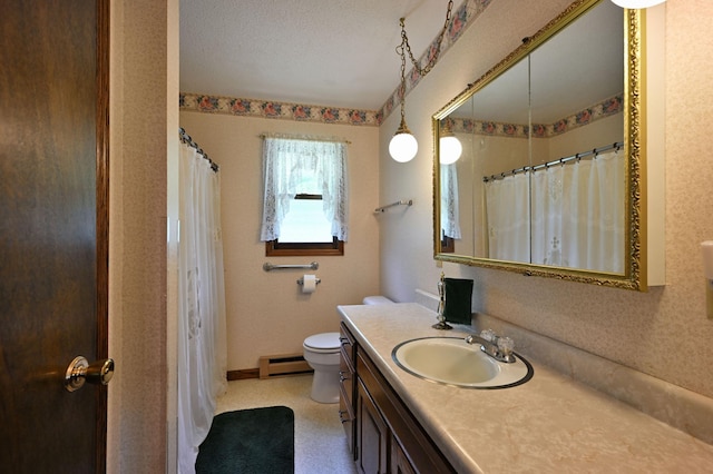W2847 County Highway B, Madge Twp, WI 54870 - bathroom featuring a baseboard heating unit, toilet, vanity, and baseboards