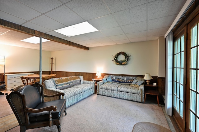 W2847 County Highway B, Madge Twp, WI 54870 - carpeted living room with a wainscoted wall, wood walls, and a drop ceiling