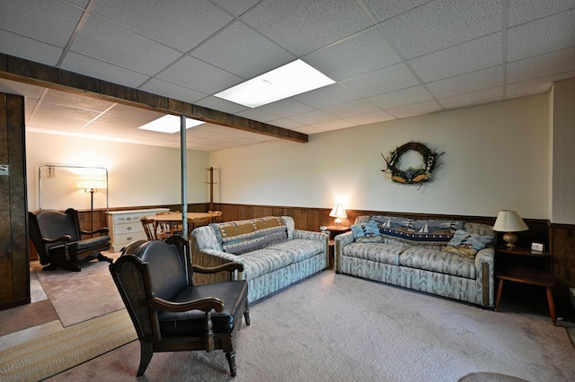 W2847 County Highway B, Madge Twp, WI 54870 - carpeted living area featuring a wainscoted wall, a paneled ceiling, and wood walls