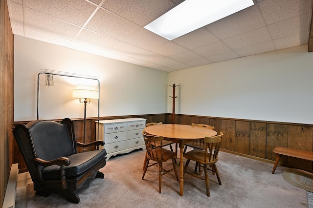 W2847 County Highway B, Madge Twp, WI 54870 - carpeted dining area with a paneled ceiling, a wainscoted wall, and wooden walls