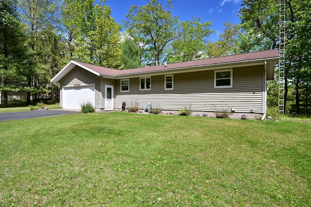 W2847 County Highway B, Madge Twp, WI 54870 - single story home featuring an attached garage, asphalt driveway, and a front lawn