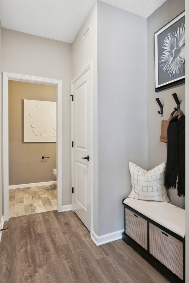 10383 Glacier Ln N, Maple Grove, MN 55369 - mudroom featuring wood finished floors and baseboards