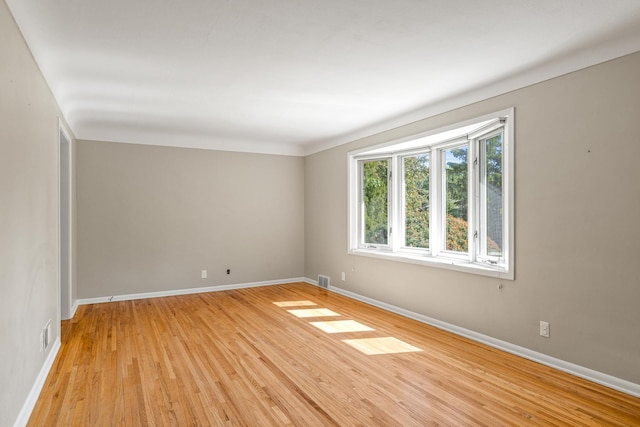 4342 Arthur St NE, Columbia Heights, MN 55421 - spare room with baseboards and light wood-type flooring