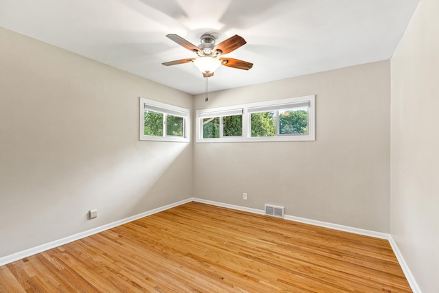 4342 Arthur St NE, Columbia Heights, MN 55421 - unfurnished room with baseboards, a ceiling fan, and light wood-style floors
