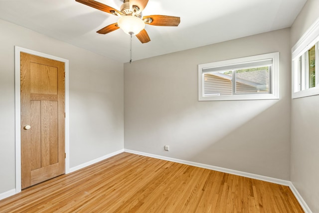 4342 Arthur St NE, Columbia Heights, MN 55421 - empty room featuring light wood-type flooring, plenty of natural light, baseboards, and ceiling fan