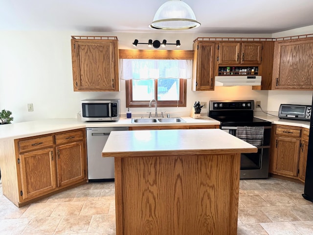 103 8th St SW, Roseau, MN 56751 - kitchen with appliances with stainless steel finishes, a sink, stone finish flooring, and under cabinet range hood