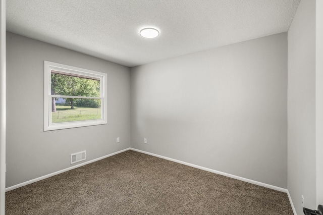 825 Elm Creek Cir, Champlin, MN 55316 - spare room with dark carpet, a textured ceiling, and baseboards