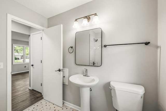 825 Elm Creek Cir, Champlin, MN 55316 - bathroom with toilet, baseboards, and a sink