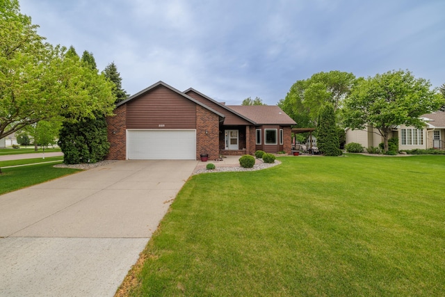 2031 Rose Creek Dr S, Fargo, ND 58104 - ranch-style house with a garage, brick siding, a front lawn, and driveway