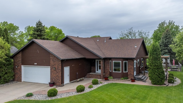 2031 Rose Creek Dr S, Fargo, ND 58104 - view of front of property with a front lawn, brick siding, an attached garage, driveway, and roof with shingles