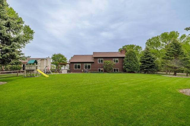 2031 Rose Creek Dr S, Fargo, ND 58104 - view of yard with a playground and central air condition unit