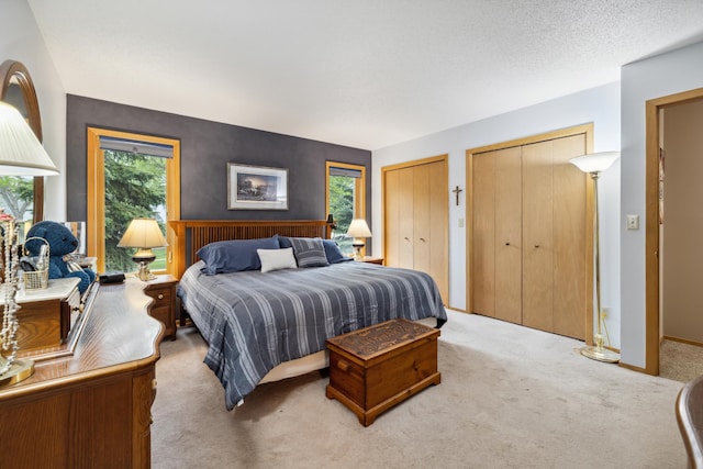 2031 Rose Creek Dr S, Fargo, ND 58104 - carpeted bedroom featuring two closets and baseboards