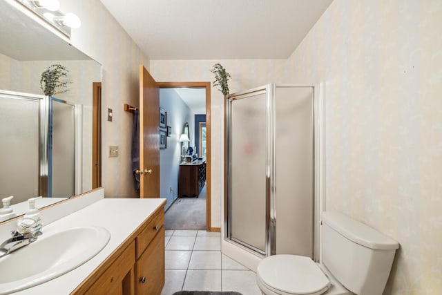 2031 Rose Creek Dr S, Fargo, ND 58104 - full bath featuring vanity, toilet, a shower stall, and tile patterned floors