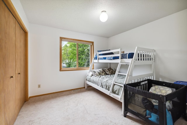 2031 Rose Creek Dr S, Fargo, ND 58104 - bedroom with carpet flooring, baseboards, and a closet