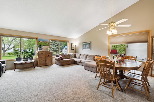 2031 Rose Creek Dr S, Fargo, ND 58104 - dining area featuring light colored carpet, ceiling fan, and high vaulted ceiling