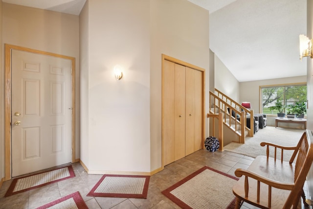 2031 Rose Creek Dr S, Fargo, ND 58104 - tiled entryway featuring stairs and baseboards