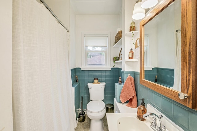 1491 Wynne Ave, Saint Paul, MN 55108 - bathroom with toilet, a wainscoted wall, tile patterned floors, tile walls, and curtained shower