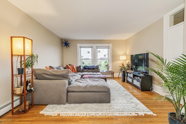 1491 Wynne Ave, Saint Paul, MN 55108 - living room featuring a baseboard radiator and light wood finished floors