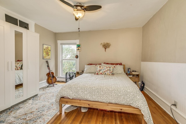 1491 Wynne Ave, Saint Paul, MN 55108 - bedroom with wood finished floors, ceiling fan, and baseboards
