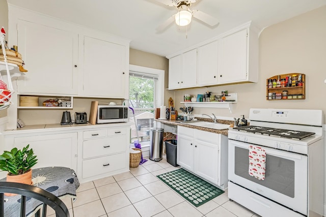 1491 Wynne Ave, Saint Paul, MN 55108 - kitchen with white appliances, open shelves, a ceiling fan, a sink, and white cabinetry