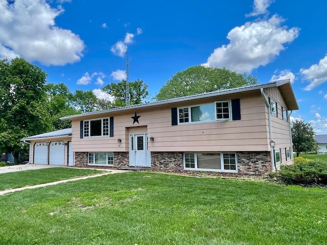 351 5th St S, Franklin, MN 55333 - bi-level home featuring a garage, a front lawn, and driveway